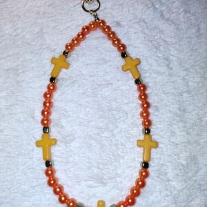 Keychain Orange With Gold Tone Featuring Cross Accents